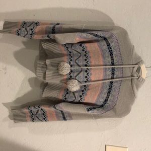 Sweater with pink snowfall across chest